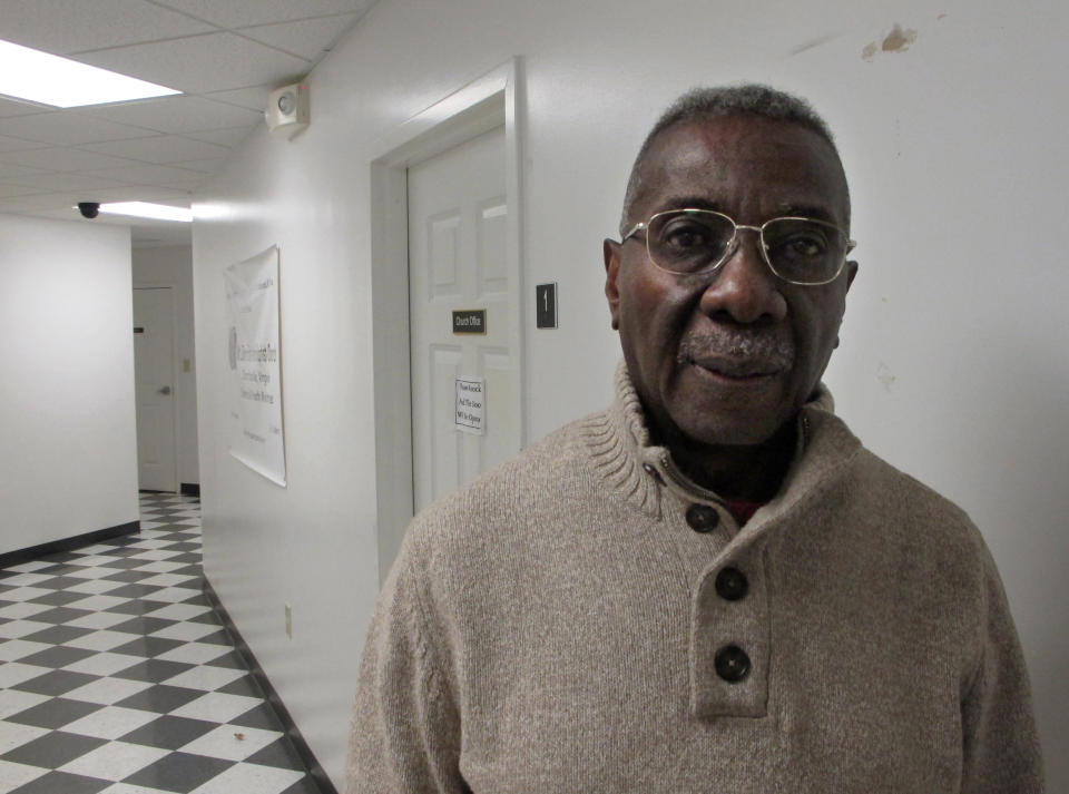 In this Monday, Jan. 27, 2014 photo, Gerald Terrell, the senior trustee for the Mount Zion First African Baptist Church, stands in the church's offices in Charlottesville, Va. He says the church sits just across the street from a public housing project where children of families often don’t have the advantages that wealthier families consider basic. At least when he was a boy, growing up in segregated central Florida, those with limited education knew they could find a job in agriculture or a factory. Today, "it’s harder because we’ve moved from an industrial society to a technological society. And who has the computer at home? The haves," says Terrell, who volunteers as a mentor to African-American boys. (AP Photo/Adam Geller)