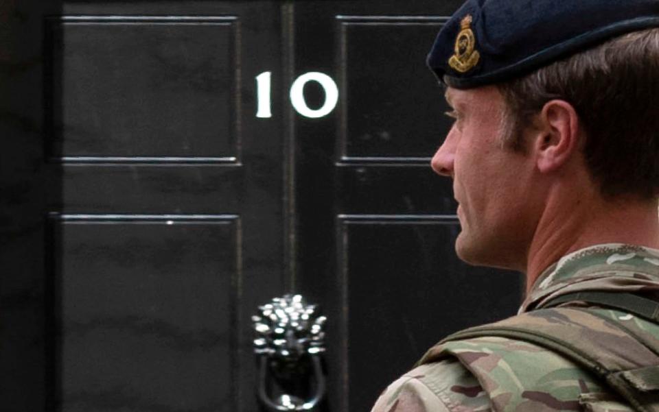 An armed soldier outside Number 10 Downing Street - Credit: JUSTIN TALLIS/AFP