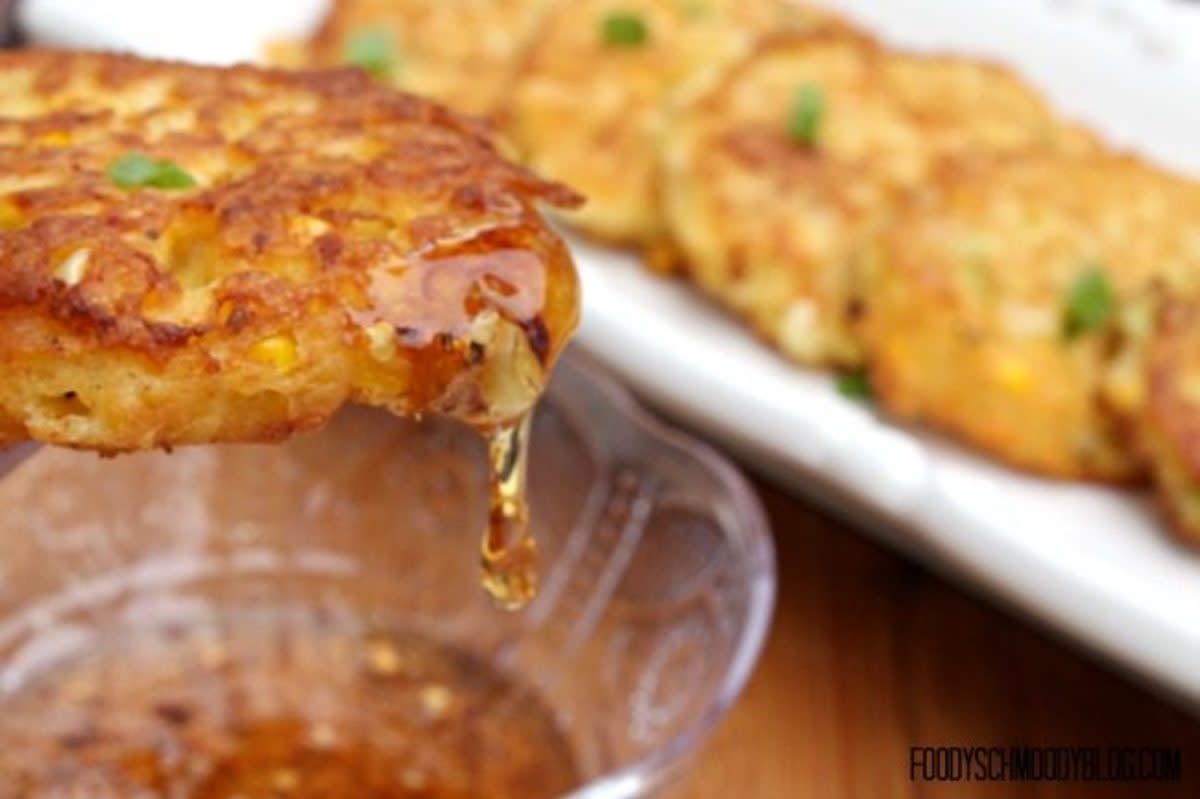 <p>Foody Schmoody Blog</p><p>The secret ingredient that make these fritters so irresistible is goat cheese in the batter!</p><p><strong>Get the recipe: <a href="https://foodyschmoodyblog.com/sweet-summer-corn-fritters/" rel="nofollow noopener" target="_blank" data-ylk="slk:Sweet Corn Fritters With Hot Honey;elm:context_link;itc:0;sec:content-canvas" class="link rapid-noclick-resp">Sweet Corn Fritters With Hot Honey</a></strong></p>