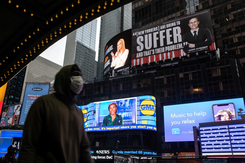 Images of Ivanka Trump and Jared Kushner are seen alongside messages about coronavirus disease (COVID-19) infections and deaths on billboards sponsored by The Lincoln Project above Times Square in New York City, U.S. October 24, 2020. Trump and Kushner's lawyer Marc Kasowitz has demanded that the billboards be removed, threatening a lawsuit.   REUTERS/Jeenah Moon