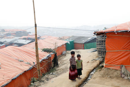 Rohingya refugee children walk in Palong Khali camp, near Cox's Bazar, Bangladesh January 14, 2018. REUTERS/Tyrone Siu