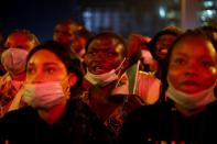 A demonstrator shouts the slogan as he holds the Nigerian flag during protest against alleged police brutality in Lagos