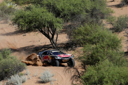 Dakar Rally - 2018 Peru-Bolivia-Argentina Dakar rally - 40th Dakar Edition stage thirteen, San Juan to Cordoba - January 19, 2018. Carlos Sainz of Spain and co-pilot Lucas Cruz of Spain drive their Peugeot. REUTERS/Andres Stapff