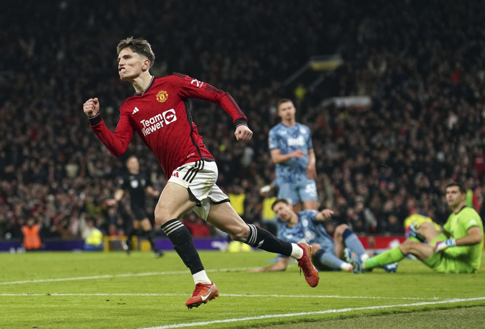 Manchester United's Alejandro Garnacho, second left, celebrates after scoring his side's first goal during the English Premier League soccer match between Manchester United and Aston Villa at the Old Trafford stadium in Manchester, England, Tuesday, Dec. 26, 2023. (Martin Rickett/PA via AP)