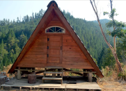 <body> <p>Go off the grid in this tiny triangular cabin, a restful retreat in Six Rivers National Forest in northwestern California. Reachable only by a remote forest road, the A-frame abode is a true hidden gem among sustainable accommodations. The space-efficient interior sleeps one comfortably, while a shared <a rel="nofollow noopener" href=" http://www.bobvila.com/slideshow/design-ideas-to-steal-from-10-amazing-outdoor-kitchens-48853?bv=yahoo" target="_blank" data-ylk="slk:outdoor kitchen;elm:context_link;itc:0;sec:content-canvas" class="link ">outdoor kitchen</a> and organic garden make cooking a fun, communal experience.</p> <p><strong>Related: <a rel="nofollow noopener" href=" http://www.bobvila.com/slideshow/assembly-required-15-diy-kit-homes-44417#.WD-pBKIrKRs?bv=yahoo" target="_blank" data-ylk="slk:Assembly Required: 15 DIY Kit Homes;elm:context_link;itc:0;sec:content-canvas" class="link ">Assembly Required: 15 DIY Kit Homes</a> </strong> </p> </body>