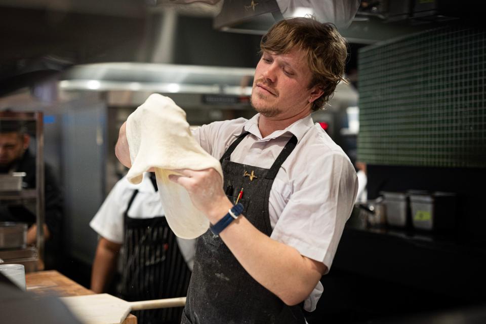 Stretching dough for Josephine’s deep dish and thin crust pizzas.