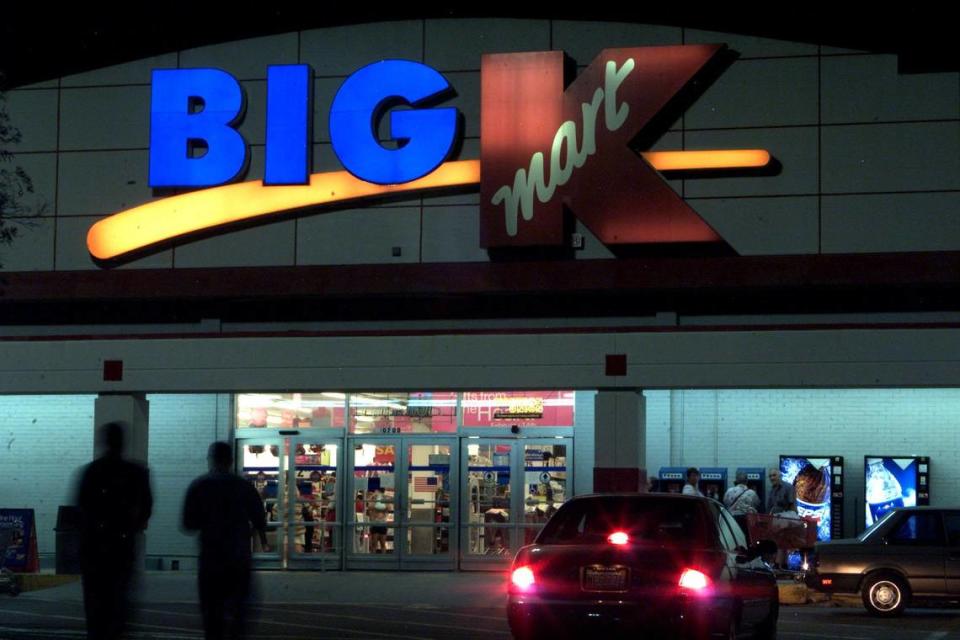 People continue to shop at a Kmart in South Florida after the corporation filed for bankrupcy in 2002.