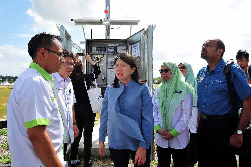 Energy, Science, Technology, Environment and Climate Change Minister Yeo Bee Yin (centre) tests the early warning pollution monitoring system in Pasir Gudang February 23, 2020. — Picture by Ben Tan