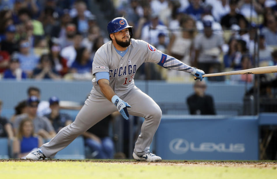 Chicago Cubs' David Bote has an RBI sacrifice fly to right field to score Kris Bryant during the fifth inning of a baseball game against the Los Angeles Dodgers in Los Angeles, Sunday, June 16, 2019. (AP Photo/Alex Gallardo)