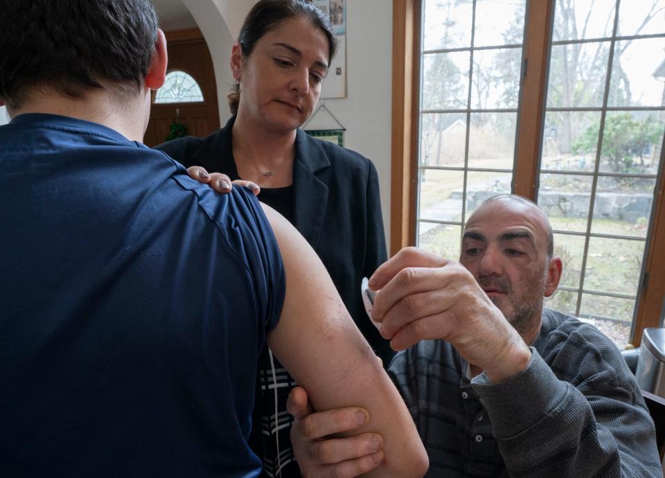 Maria Chiodi, center, and Richard Cefalo treat their 12-year-old son's Type 1 diabetes with an Omnipod 5 insulin pump.  A dispute between Chiodi's health insurer and the company that makes the pump leaves her with a monthly bill of $872 for his care.