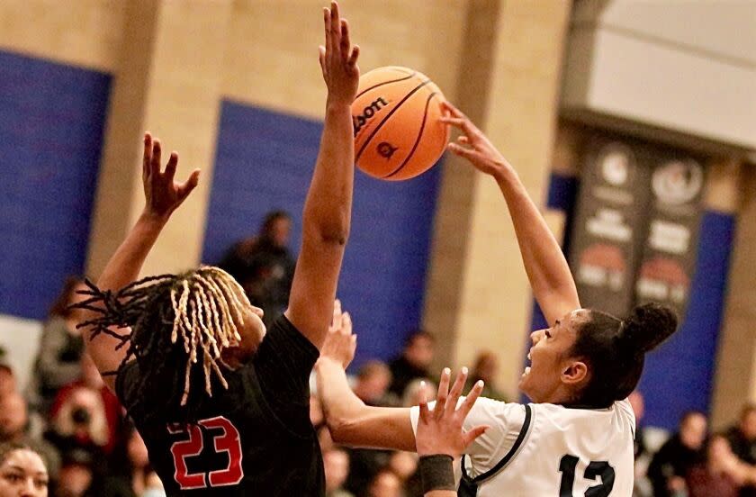 Sierra Canyon's Juju Watkins attempts a shot over Etiwanda's Sa'lah Hemingway on Tuesday night.