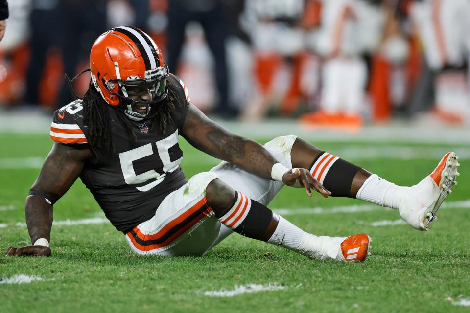 Cleveland Browns defensive end Takkarist McKinley grimaces after an injury during the second half of an NFL football game against the Las Vegas Raiders, Monday, Dec. 20, 2021, in Cleveland. (AP Photo/Ron Schwane)