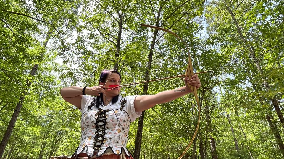 Tiphenie Bryan practices archery at EastWind Castle and Village in Trenton, S.C., on April 29.