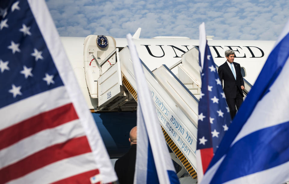 U.S. Secretary of State John Kerry steps off the plane upon his arrival at Ben Gurion airport near Tel Aviv, Israel, Thursday, Jan. 2, 2014. Kerry arrived Thursday in Israel to broker Mideast peace talks that are entering a difficult phase aimed at reaching a two-state solution between the Israelis and Palestinians. (AP Photo/Brendan Smialowski, Pool)