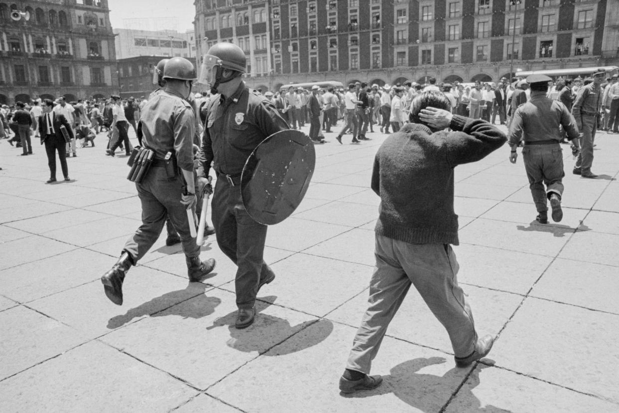 <span>Police respond to demonstrators in Mexico City in 1968, during Mexico’s ‘dirty war’, when any form of dissent was violent repressed.</span><span>Photograph: Bettmann/Bettmann Archive</span>