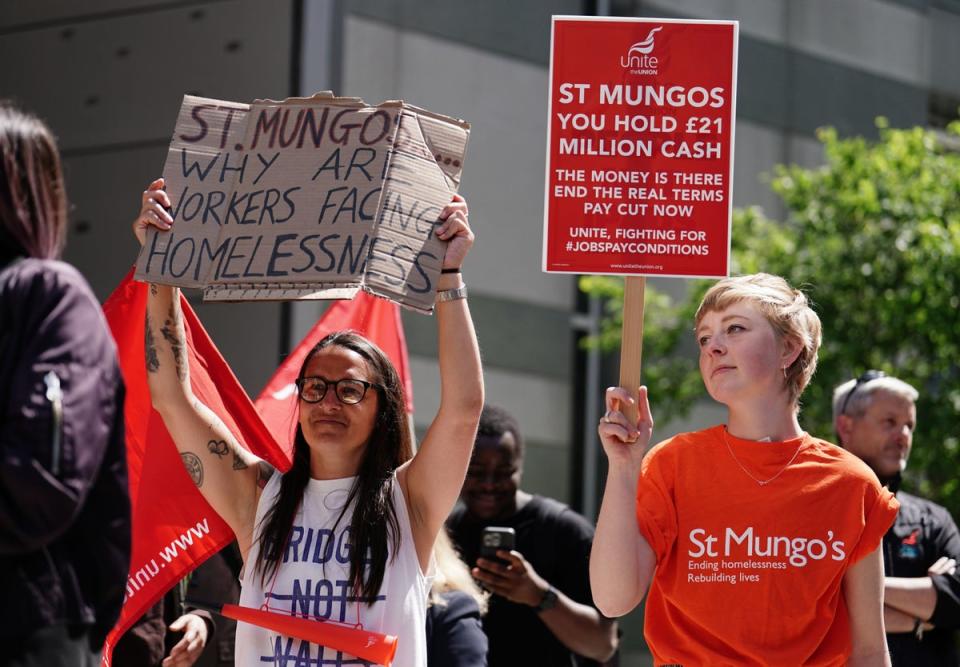 St Mungo's workers protest outside the homeless charity's head quarters in Tower Hill, London, as they begin a month long strike over pay (PA)