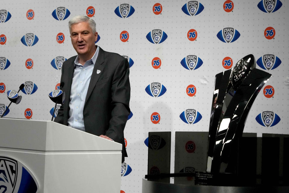 Dec. 3, 2021; Las Vegas, Nevada; Pac-12 commissioner George Kliavkoff speaks beside the championship trophy before the 2021 Pac-12 Championship Game between the Oregon Ducks and the Utah Utes at Allegiant Stadium. Kirby Lee-USA TODAY Sports