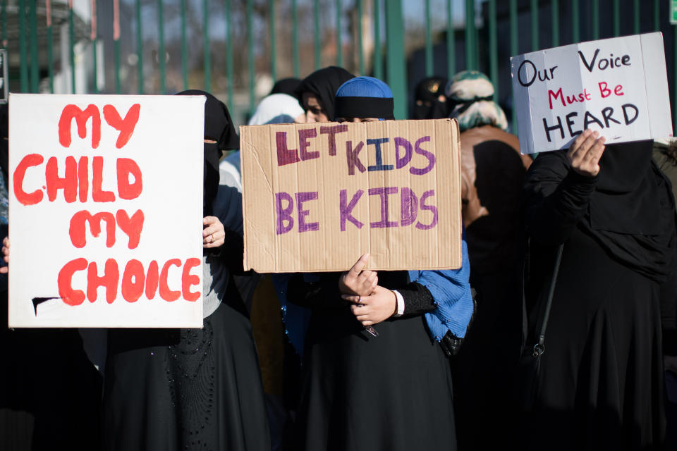 Parents, children and protestors demonstrate against the lessons about gay relationships, which teaches children about LGBT rights at the Anderton Park Primary School, Birmingham. (Credit: PA)