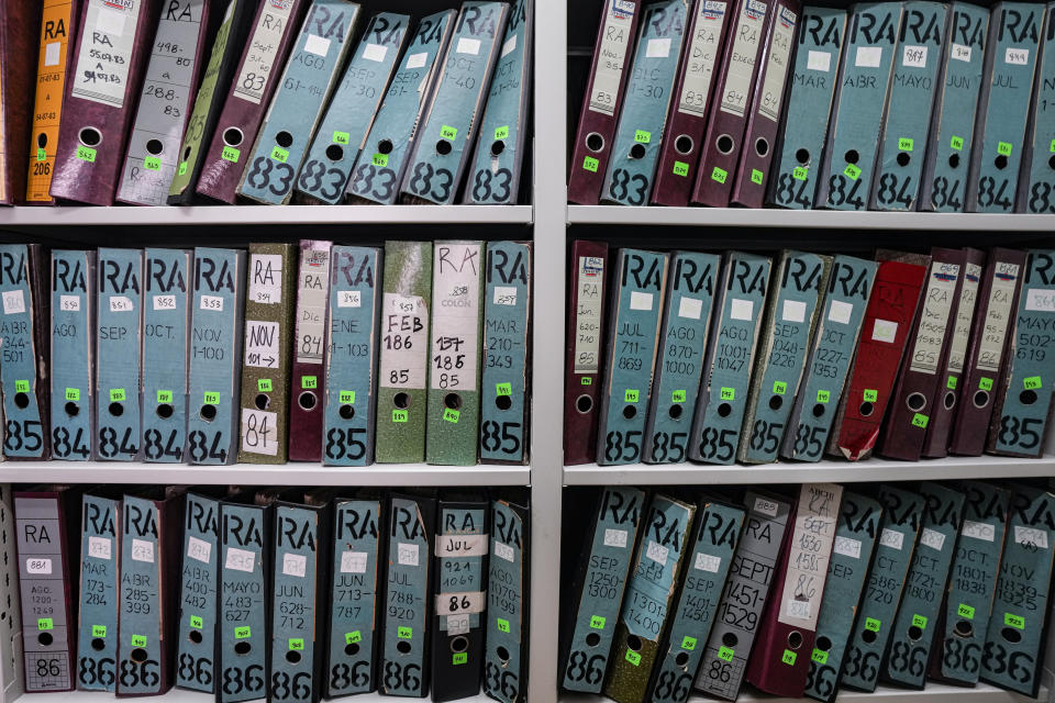 Archive folders line the shelves at the Documentation and Archive Foundation of the Vicariate of Solidarity, in Santiago, Chile, Tuesday, July 25, 2023. The shelves preserve thousands of instances of human rights violations during the dictatorship of Augusto Pinochet. (AP Photo/Esteban Felix)