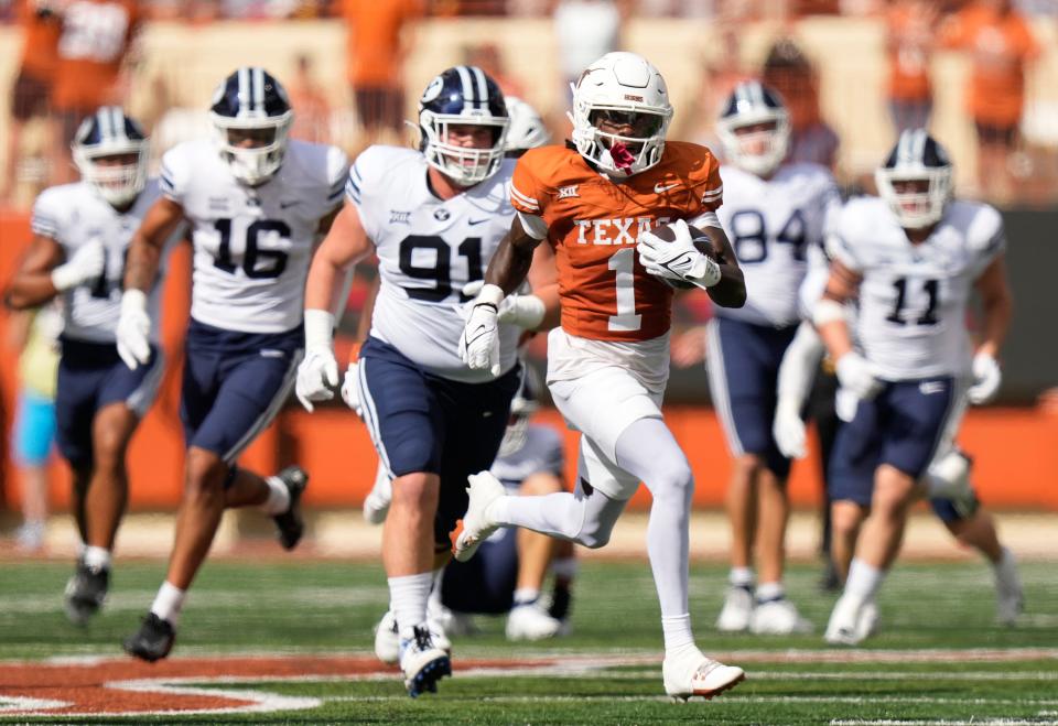 Texas' Xavier Worthy cuts upfield on his way to a 75-yard punt return touchdown in the first quarter of Saturday's home game against BYU at Royal-Memorial Stadium.