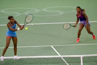 <p>Venus and Serena Williams in action in the Womens Doubles Tennis Final at the NSW Tennis Centre on Day 13 of the Sydney 2000 Olympic Games in Sydney, Australia. Mandatory Credit: Clive Brunskill /Allsport </p>