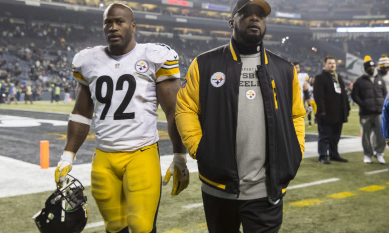 James Harrison and Mike Tomlin walk off the field.