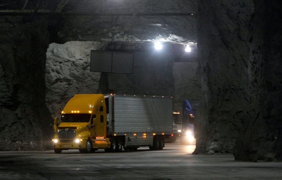 Tractor-trailers drive through the cavernous Springfield Underground in this March 12, 2015 file photo.
