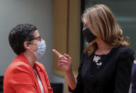 Spain's Foreign Minister Arancha Gonzalez, left, speaks with Bulgaria's Foreign Minister Ekaterina Zharieva during a meeting of EU foreign ministers at the European Council building in Brussels, Monday, July 13, 2020. European Union foreign ministers meet for the first time face-to-face since the pandemic lockdown and will assess their discuss their relations with China and Turkey. (Stephanie Lecocq, Pool Photo via AP)