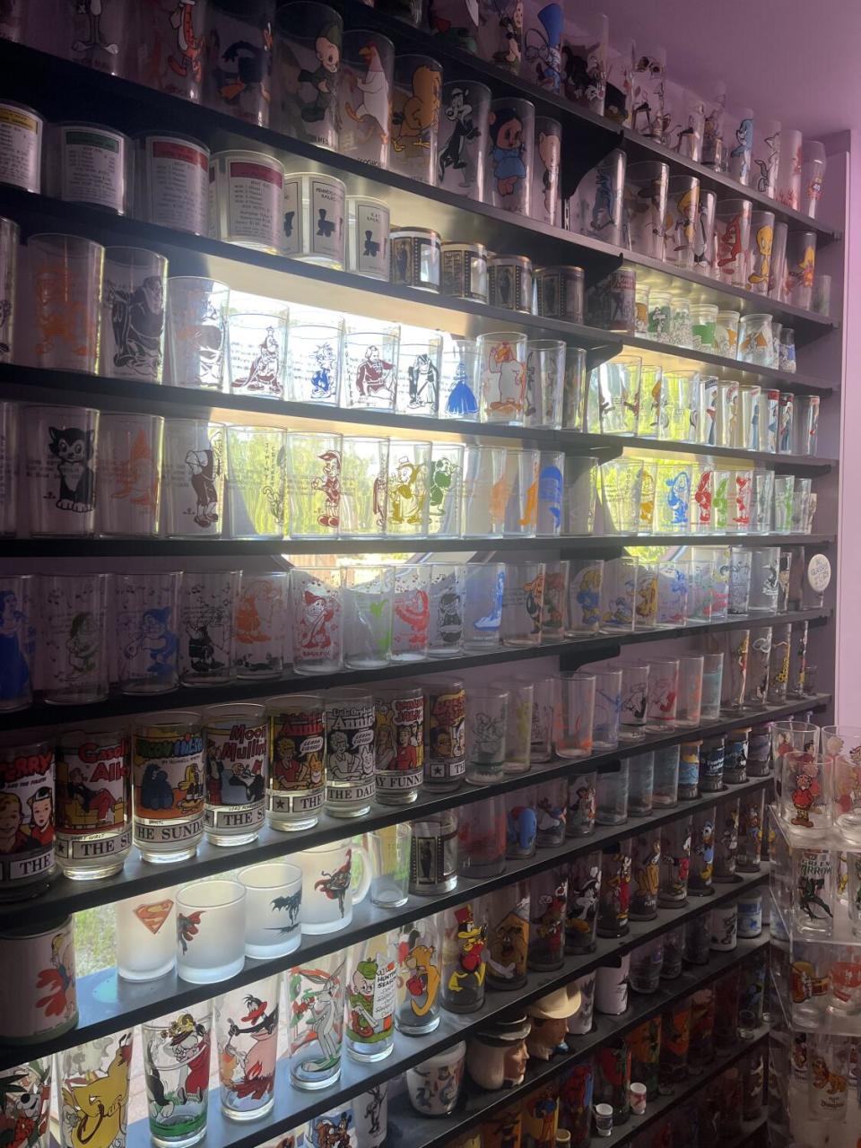 A wall full of jelly glasses from the 1960s.