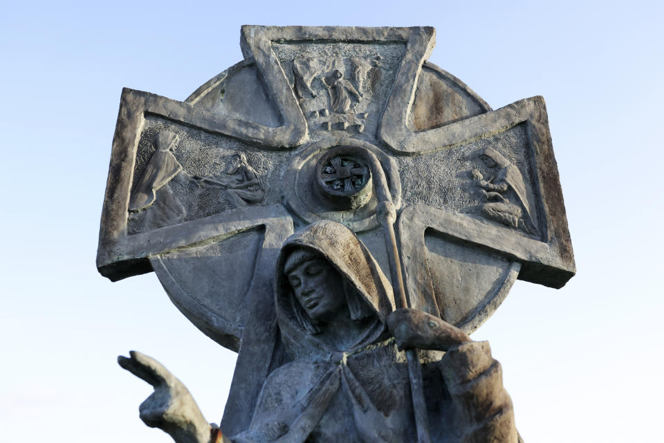 A close-up of a statue of St Brigid in Kildare, Ireland, Tuesday, Jan. 31, 2023. St. Brigid of Kildare, a younger contemporary of St. Patrick, is quietly and steadily gaining a following, in Ireland and abroad. Devotees see Brigid, and the ancient Irish goddess whose name and attributes she shares, as emblematic of feminine spirituality and empowerment. (AP Photo/Peter Morrison)
