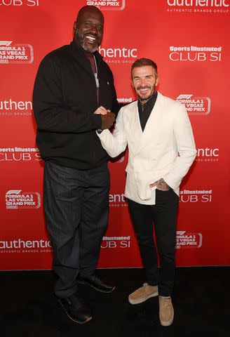 <p>Shaquille-O-Neal-David-Beckham-111923</p> Shaquille O'Neal (left) and David Beckham attend the Sports Illustrated Club SI event at the F1 Grand Prix.