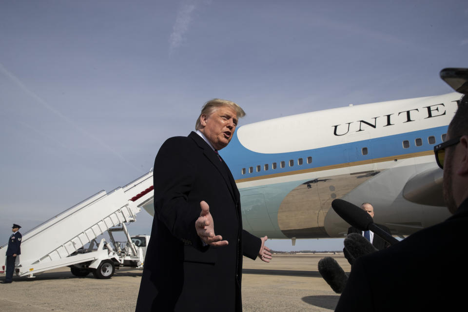 President Donald Trump speaks with reporters as he boards Air Force One as he departs Tuesday, Feb. 18, 2020, at Andrews Air Force Base, Md.(AP Photo/Alex Brandon)