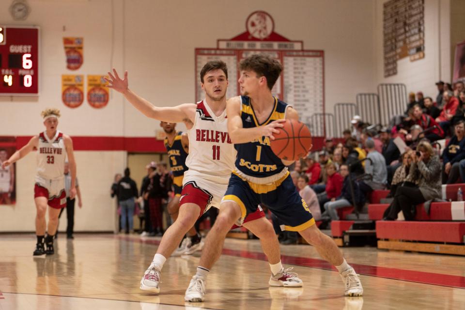 Bellevue senior Kyle Birk defends against Climax-Scotts sophomore Luke Lawrence during a game at Bellevue High School on Tuesday, Jan. 31, 2023.