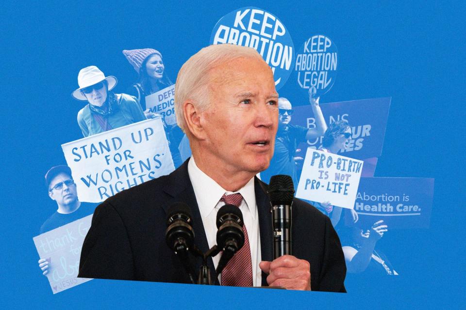 Joe Biden with abortion rights protesters in the background.
