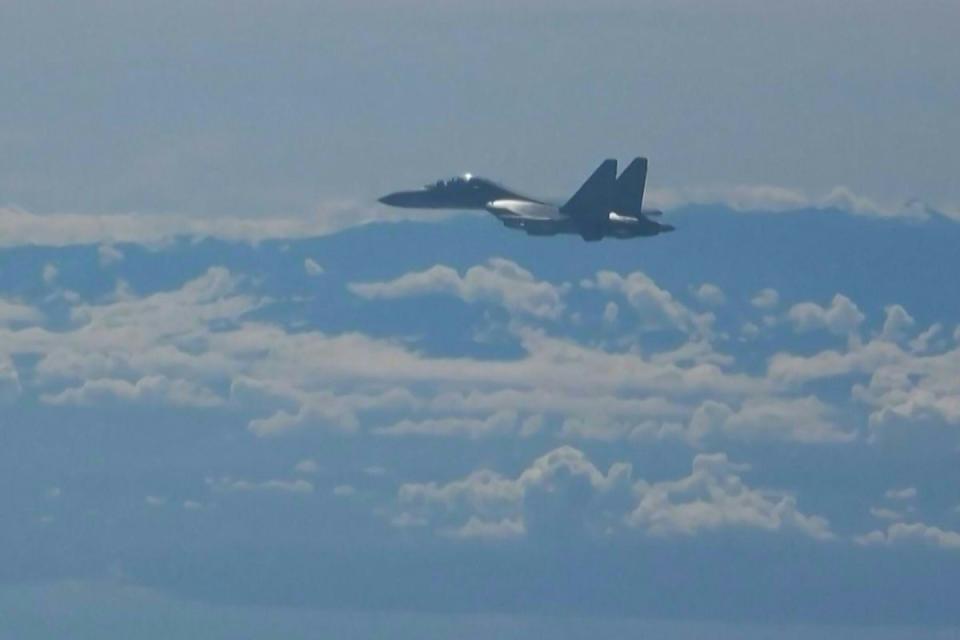 A Chinese military jet flies as part of military exercises near Taiwan on Friday (AFP/Getty)