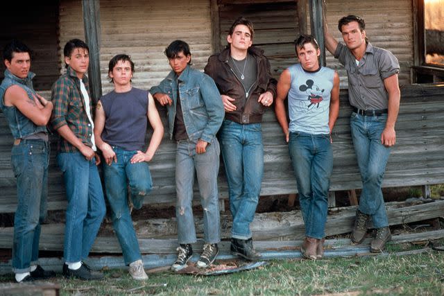 <p>Nancy Moran/Sygma via Getty</p> From L: Tom Cruise, Rob Lowe, C. Thomas Howell, Ralph Macchio, Matt Dillon, Emilio Estevez and Patrick Swayze on the set of <em>The Outsiders</em> (1983)