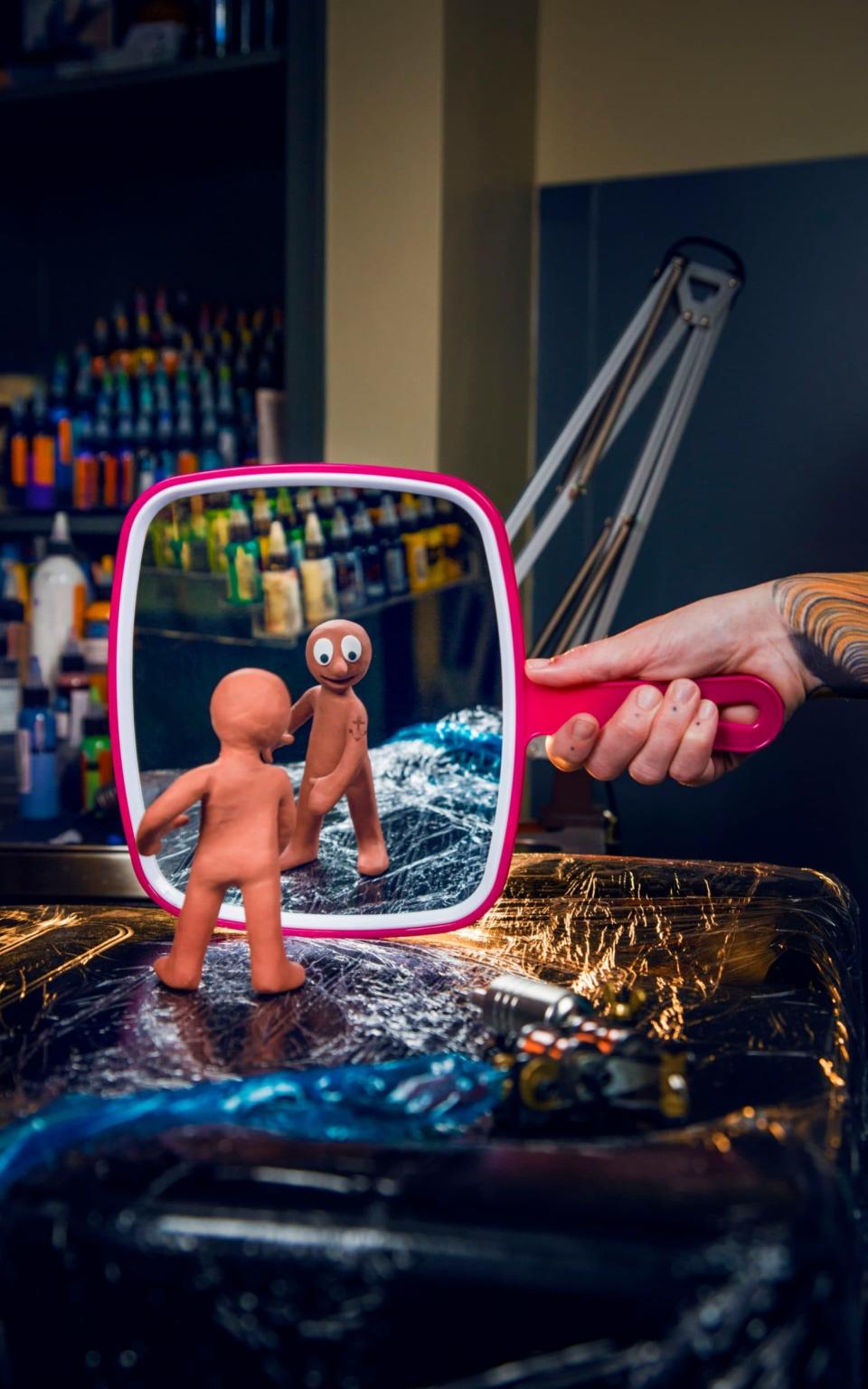 Morph admires his tattoo - Credit: Photography by Matt Crockett/Aardman productions