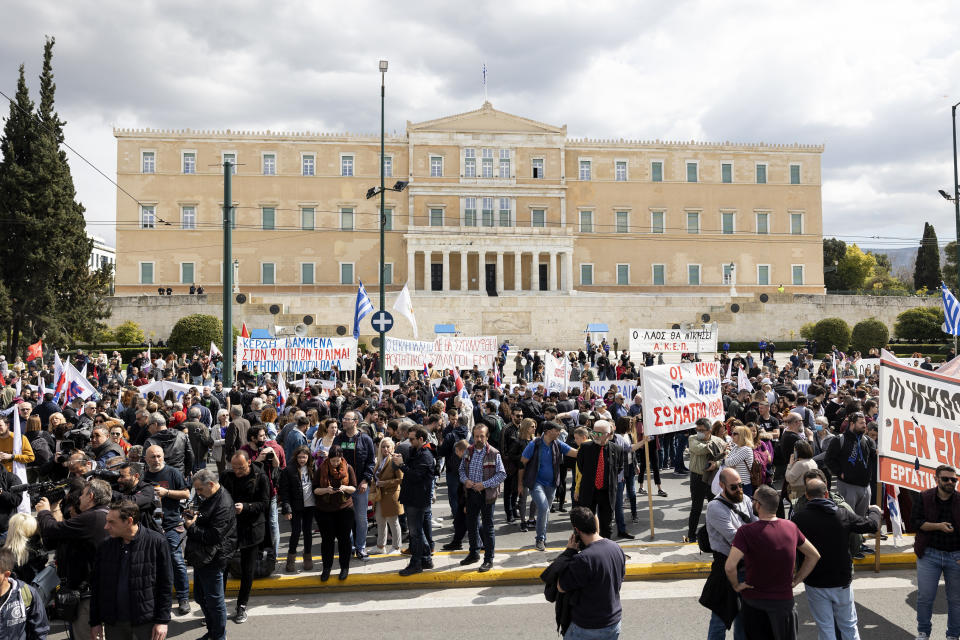 Protesters take part in a rally following a train collision in central Greece, in front of the parliament, in Athens, Sunday, March 12, 2023. Thousands of people protested Sunday against safety deficiencies in Greece's railway network and to demand the punishment of those responsible for the deadliest accident in the country's history, which killed 57 on Feb. 28, when a freight train and a passenger train that had been mistakenly directed to the same track collided head-on in central Greece. (AP Photo/Yorgos Karahalis)