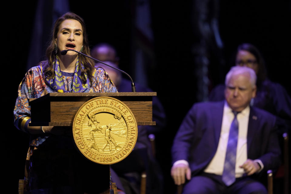 Minnesota Lt. Governor Peggy Flanagan delivers a speech as Minnesota Gov. Tim Walz, right, listens after being sworn in for her second term during her inauguration, Monday, Jan. 2, 2023, in St. Paul, Minn. (AP Photo/Abbie Parr)