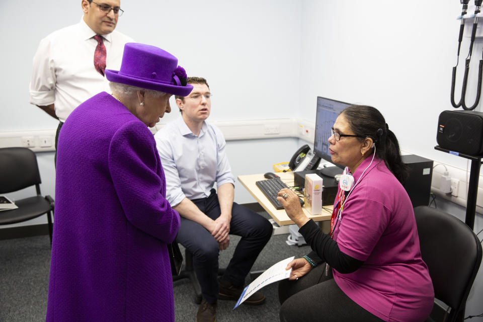 Queen Elizabeth II meeting Volunteer Vinnari Shah during the official opening of the new premises of the Royal National ENT and Eastman Dental Hospitals in London.