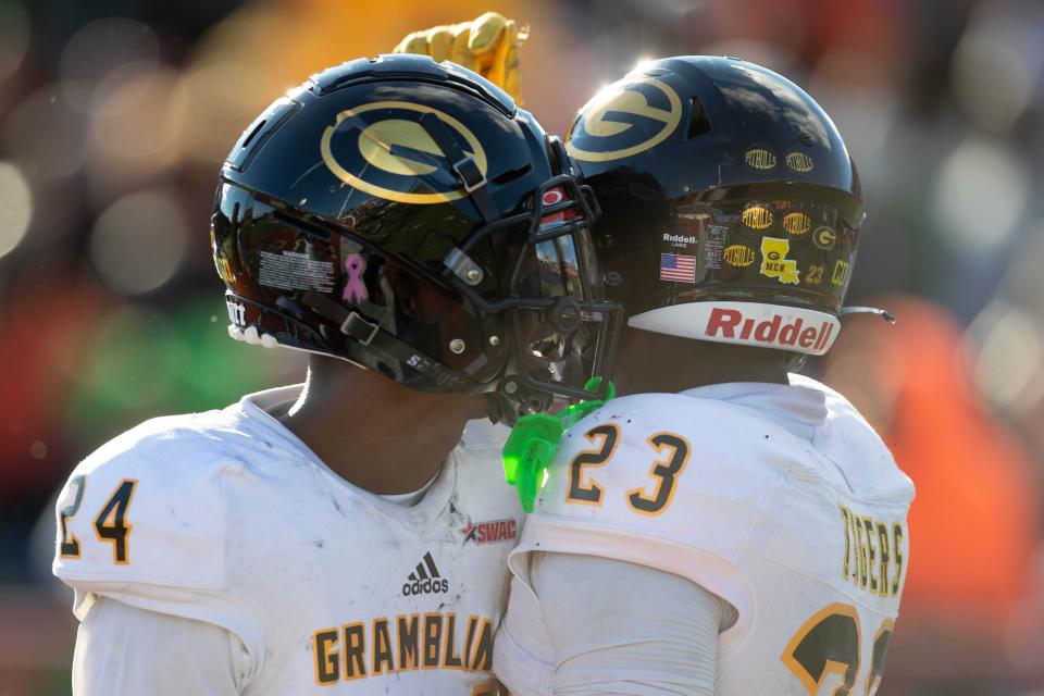 Grambling State Tigers defensive back Reyondous Estes (24) and Grambling State Tigers defensive back Kenan Fontenot (23) celebrate an interception made by Fontenot during a game between FAMU and Grambling State University at Bragg Memorial Stadium on FAMU's homecoming Saturday, Oct. 30, 2021.