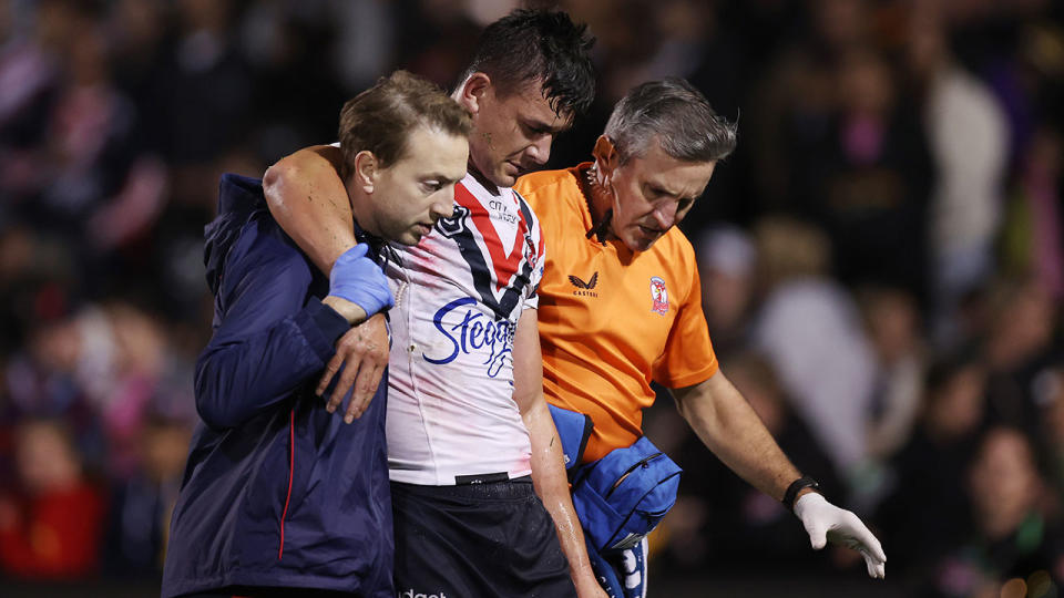 Joseph Manu hobbled off the field with an ankle injury for the Roosters. Pic: Getty