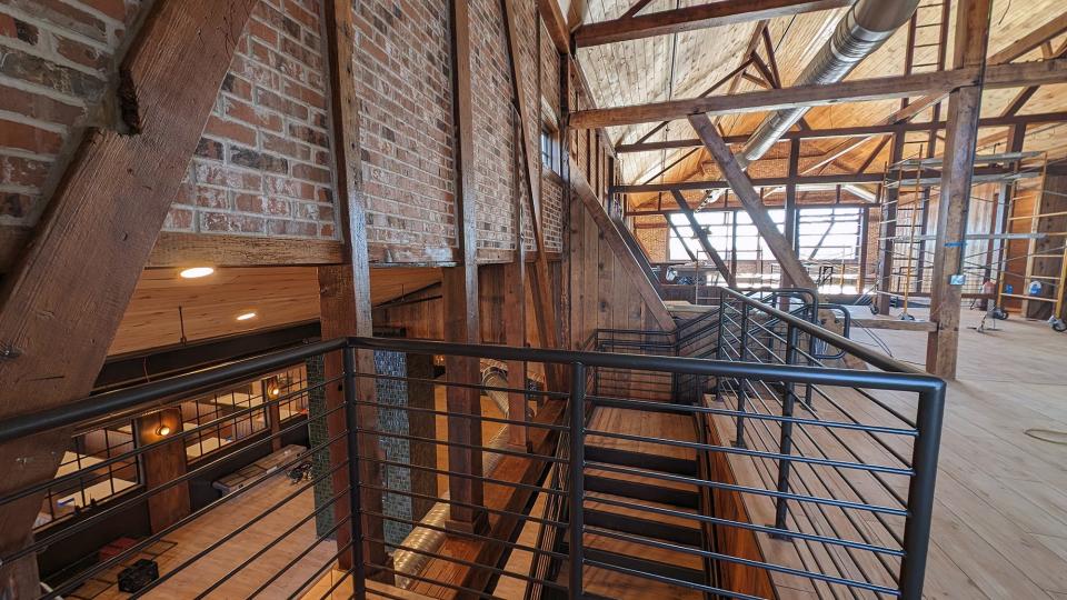 A stairway from the front foyer leads to the second floor of Spruce on Blackbridge.