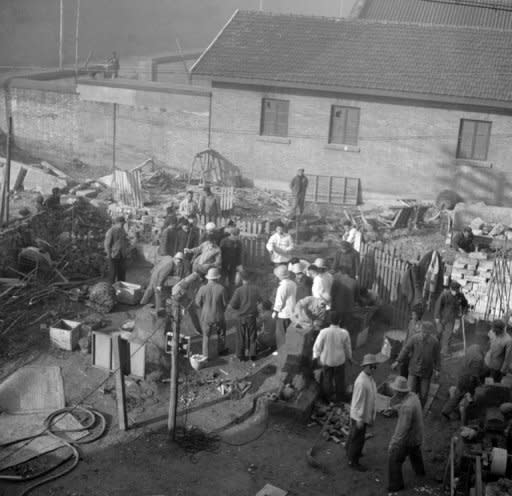 File picture. Employees of the Shin Chiao Hotel in Beijing build in the hotel courtyard in October 1958 a small and rudimentary smelting steel furnace during the period of the "Great Leap Forward" (1958-1959). Tens of millions of people died in the initiative that was launched by Mao Zedong, but the subject is taboo in modern-day China