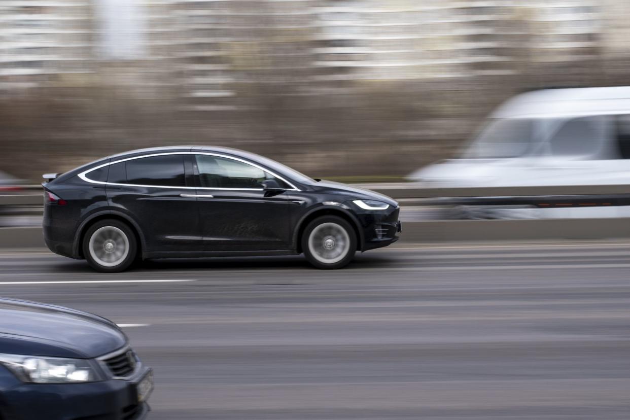Ukraine, Kyiv - 18 March 2021: Black TESLA Model X car moving on the street. Editorial