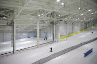 Snowboarders and skiers enjoy the grand opening of Big Snow in East Rutherford, N.J., Thursday, Dec. 5, 2019. The facility, which is part of the American Dream mega-mall, is North America's first indoor ski and snowboard slope with real snow. (AP Photo/Seth Wenig)