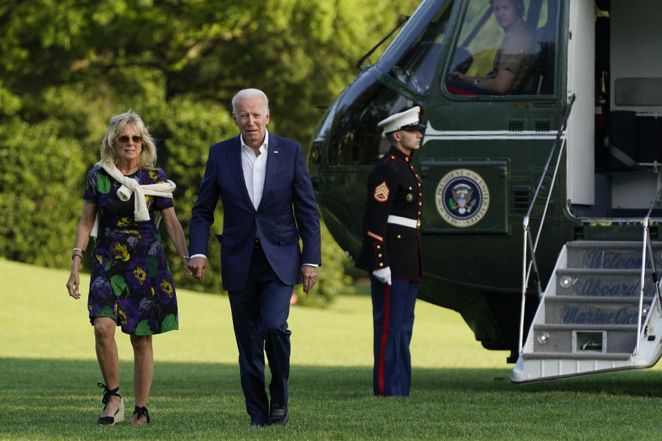 President Joe Biden and first lady Jill Biden walk on the South Lawn of the White House after stepping off Marine One, Sunday, June 27, 2021, in Washington. (AP Photo/Patrick Semansky)