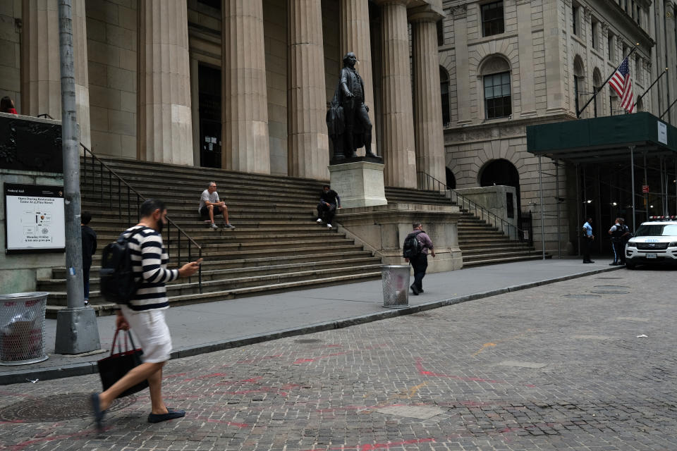 NEW YORK, NEW YORK - SEPTEMBER 02: People walk along Wall Street in the Financial District on September 02, 2020 in New York City. The Dow gained 454.84 points, or 1.59 percent, to close at 29,100.50. Closing less than 2 percent from an all-time high, the Dow posted its best rally since mid-July and closed. (Photo by Spencer Platt/Getty Images)