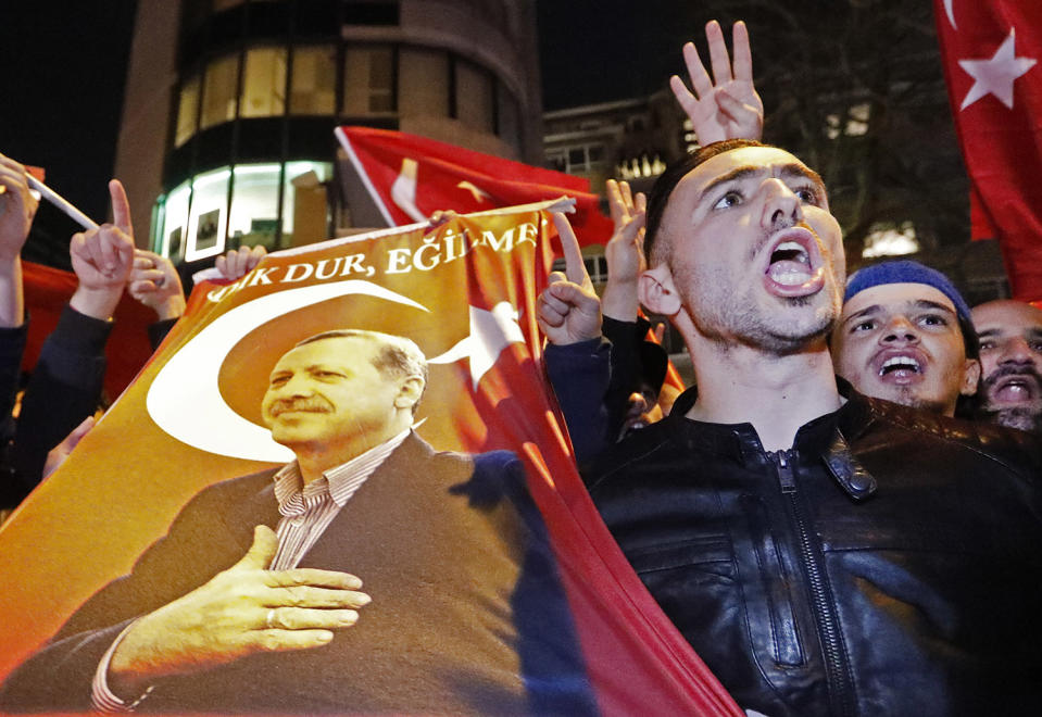 Demonstrators gather outside the Turkish consulate