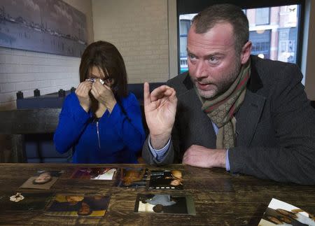 Ozana Rodrigues, the mother of Brian De Mulder, and Dimitri Bontinck, father of Jejoen Bontinck, who both have seen their son leaving for Syria after being indoctrinated by Islamist group Sharia4Belgium, react during an interview with Reuters in Antwerp January 29, 2015. REUTERS/Yves Herman